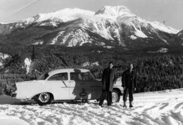 View of Mt. Truax in winter, from Lajoie Dam, BCE car & staff in foreground